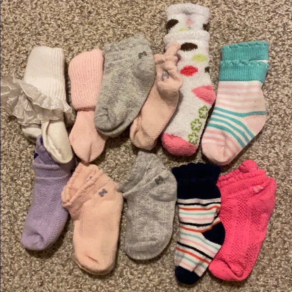 11 pair of baby/toddler socks